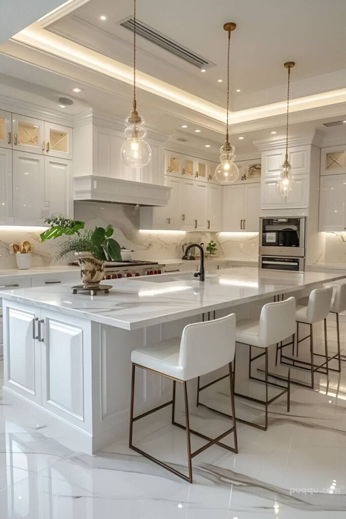 Luxurious white kitchen with illuminated ceiling details.