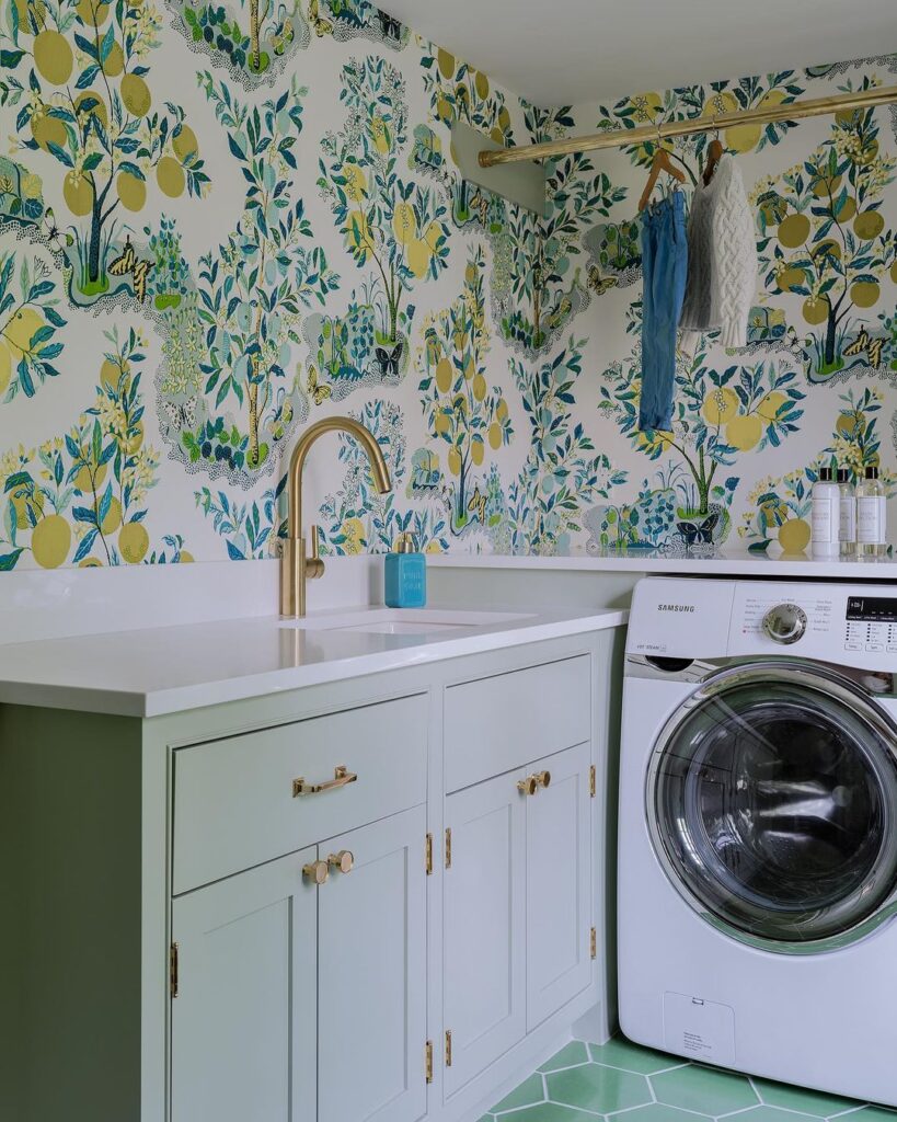 Laundry room with lemon tree wallpaper and mint accents.