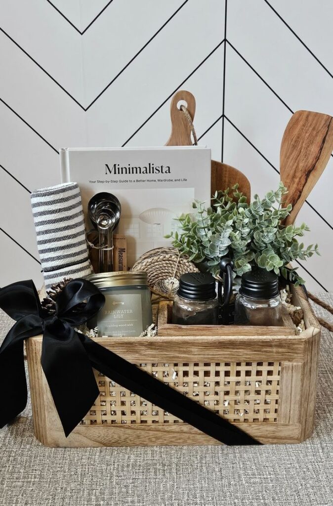 Wooden crate filled with minimalist-inspired housewarming gifts.