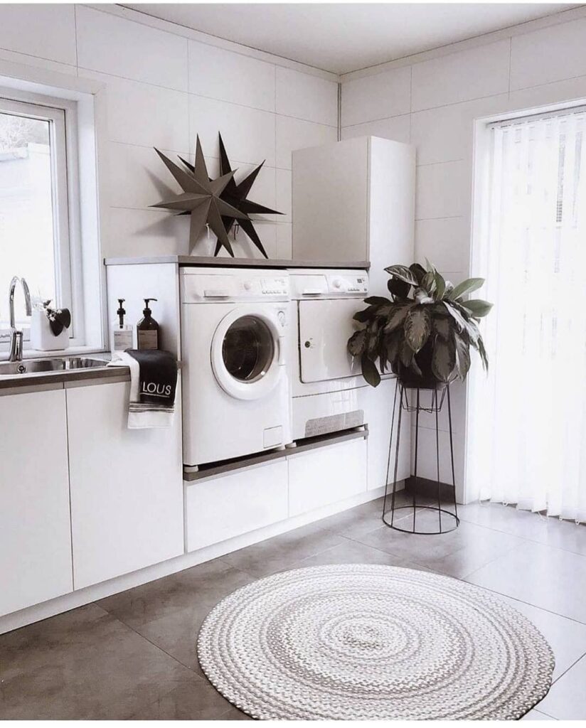 White laundry room with star decor plant and round rug