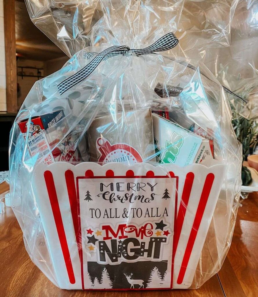 Christmas movie night gift basket with popcorn bucket and snacks