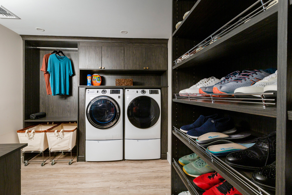 Laundry room with washer dryer and built-in shoe storage