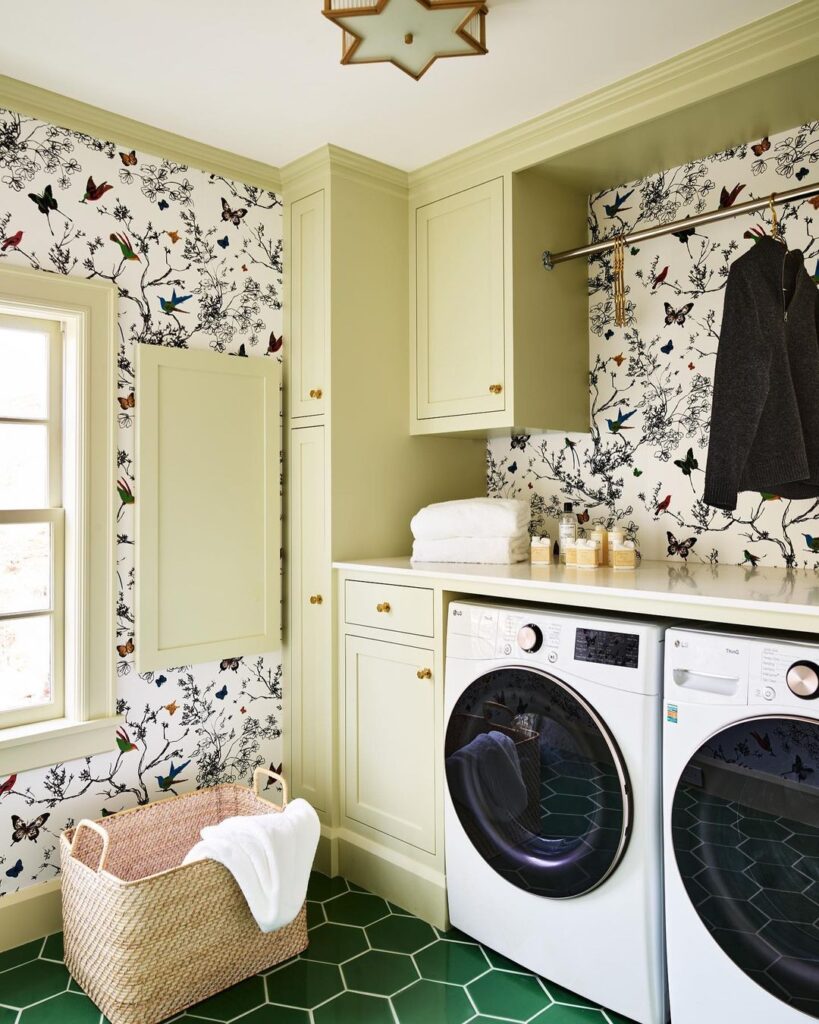 Laundry room with bird and butterfly wallpaper.