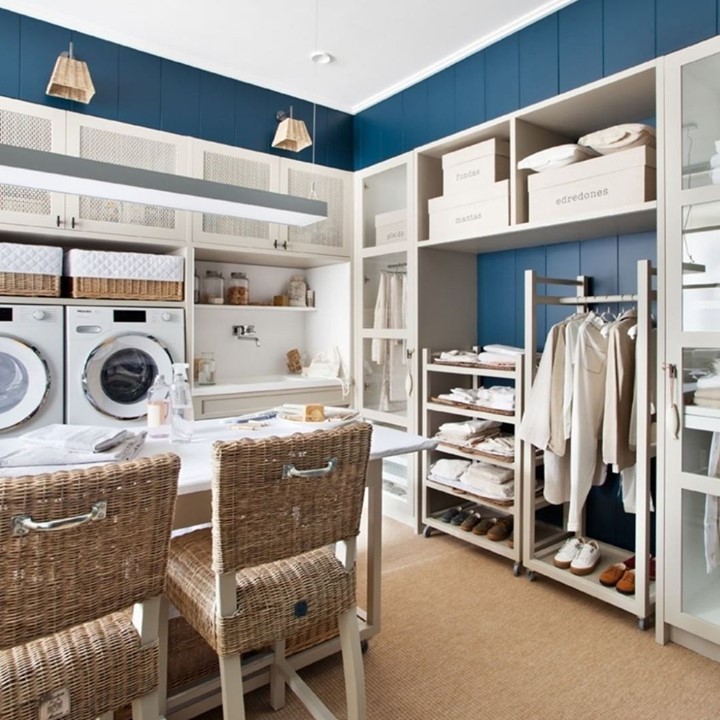 Blue-accented laundry room with dressing area.