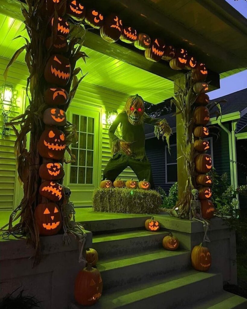 Green-lit porch with glowing pumpkin towers