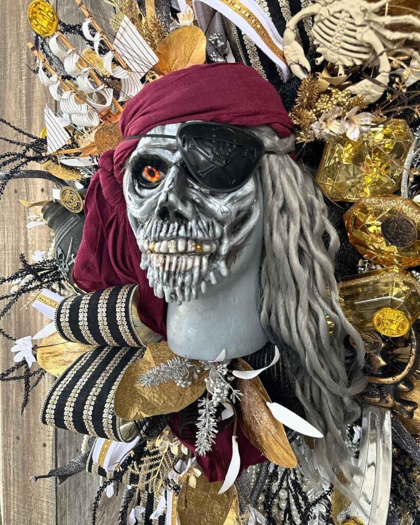 Pirate skeleton wreath with gold coins and treasure.