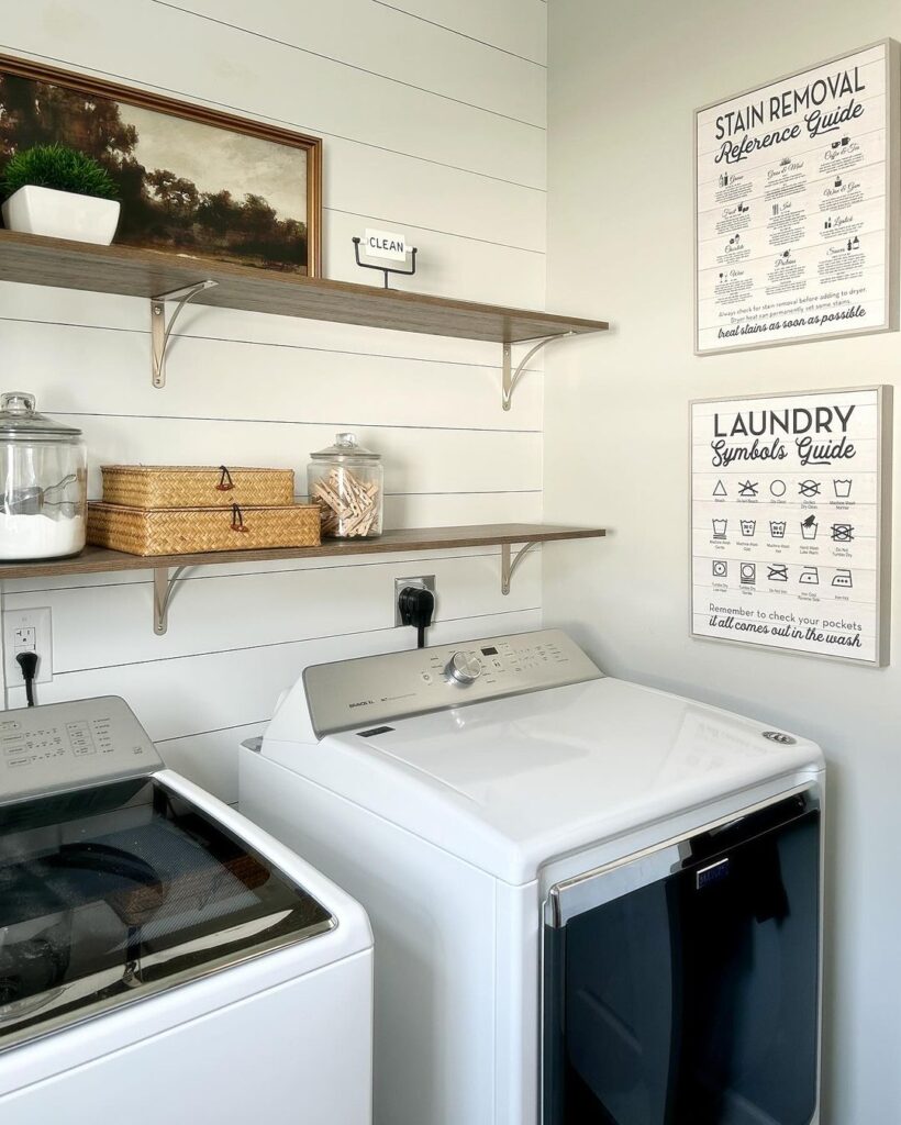 Laundry room with shiplap walls appliances and instructional posters