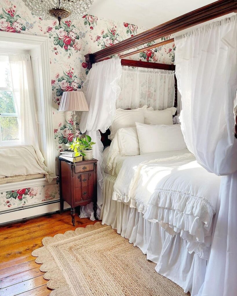 Floral wallpapered bedroom with canopy bed and vintage decor