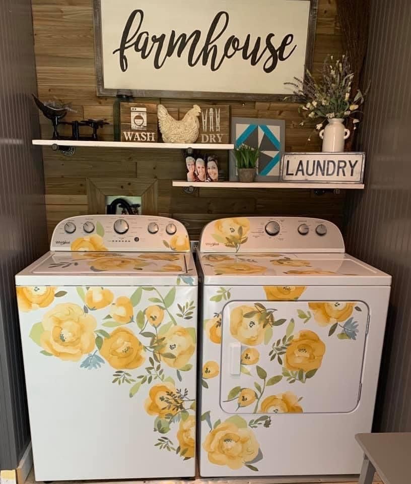 Farmhouse laundry room with floral painted washers and rustic decor