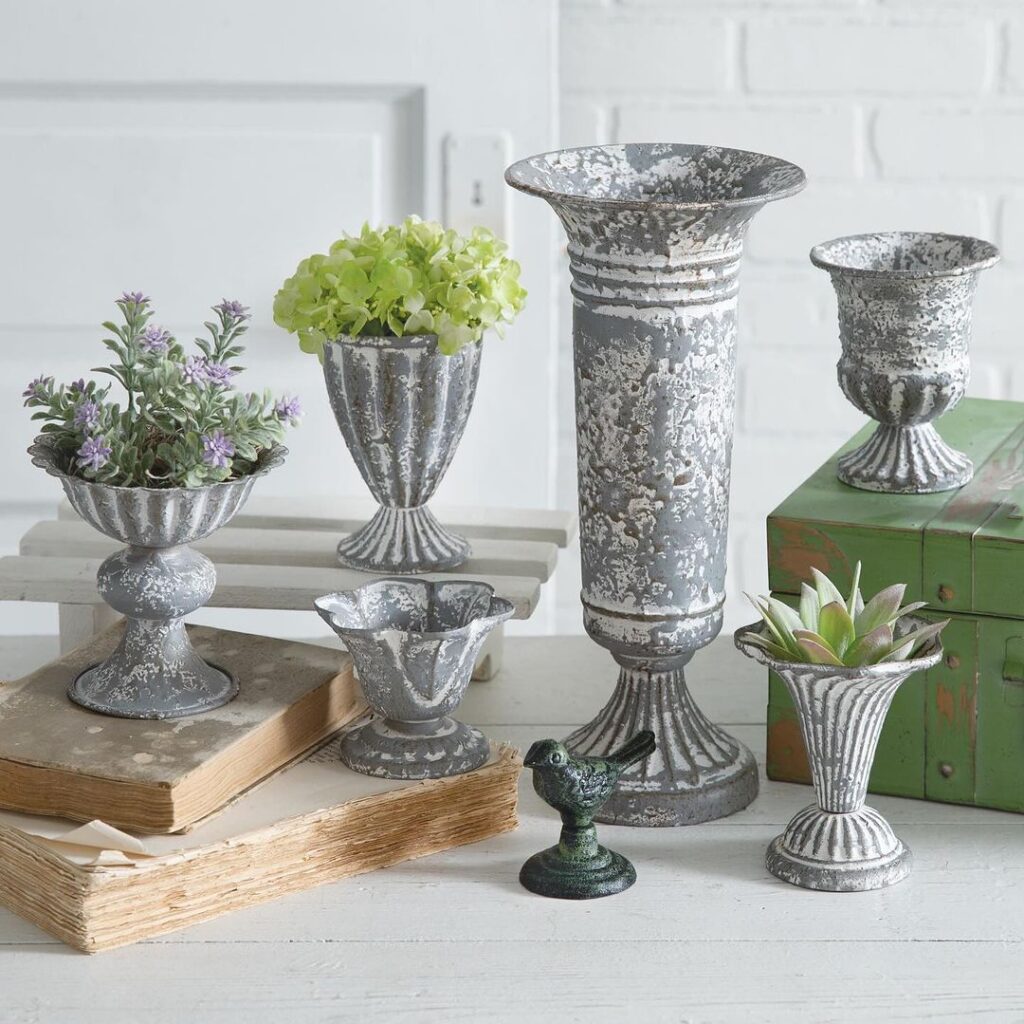 Distressed metal planters with flowers and succulents