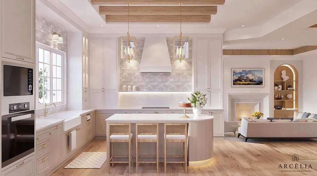 Bright kitchen with wooden beams and cream cabinets.