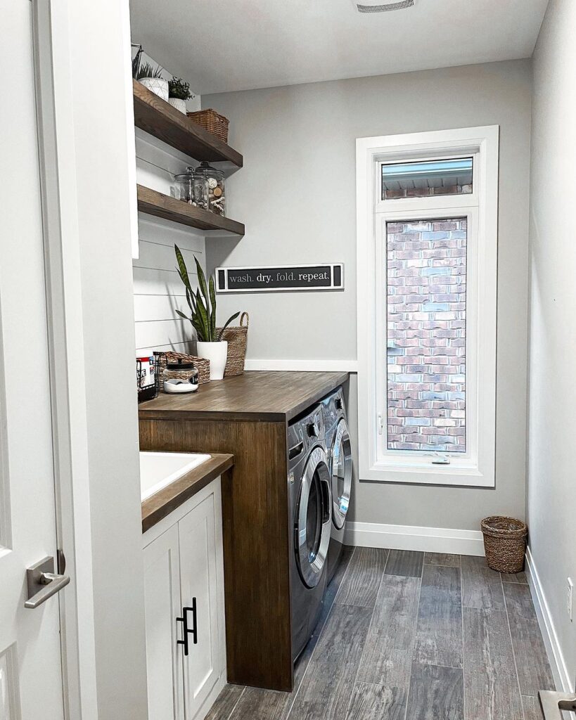 Farmhouse laundry room with rustic wooden elements.