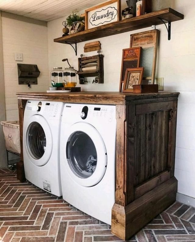 Laundry room with rustic wood cabinet hiding modern machines.