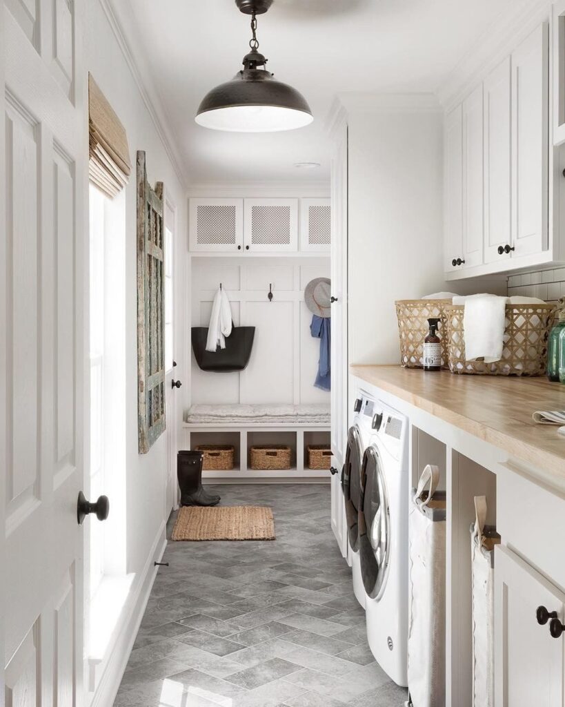 White laundry room with mudroom area and rustic accents.