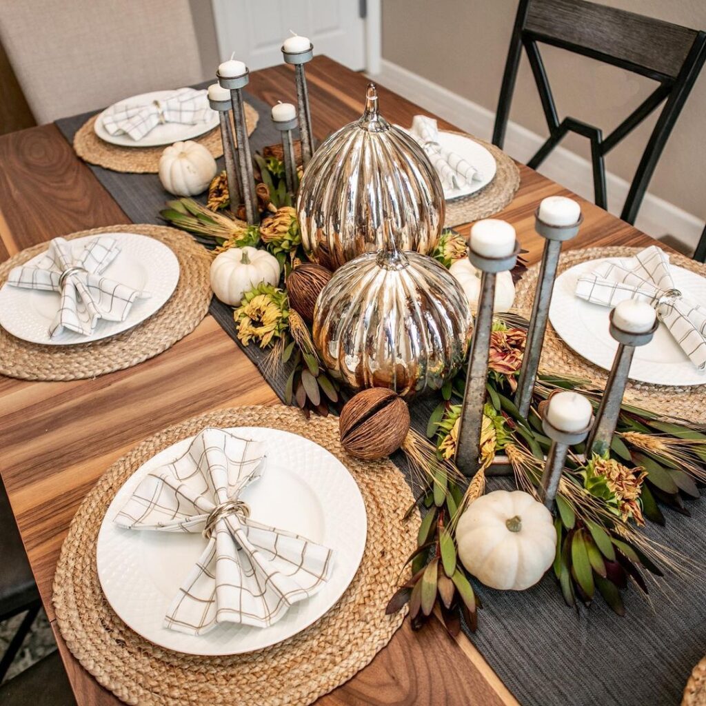 Elegant Thanksgiving table with metallic pumpkin centerpiece