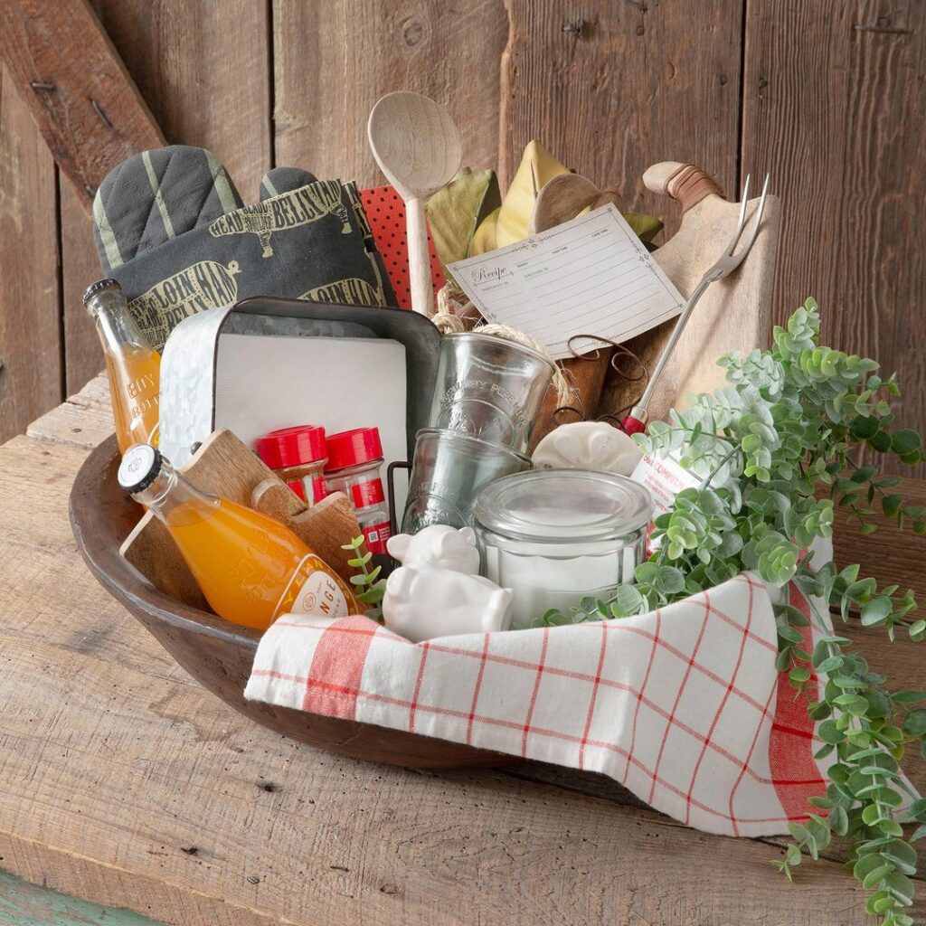 Wooden bowl with diverse kitchen items and greenery.