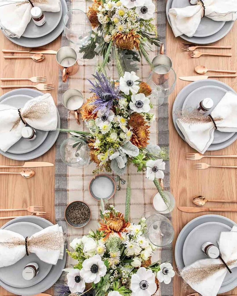 Thanksgiving table with wildflower centerpiece and plaid runner