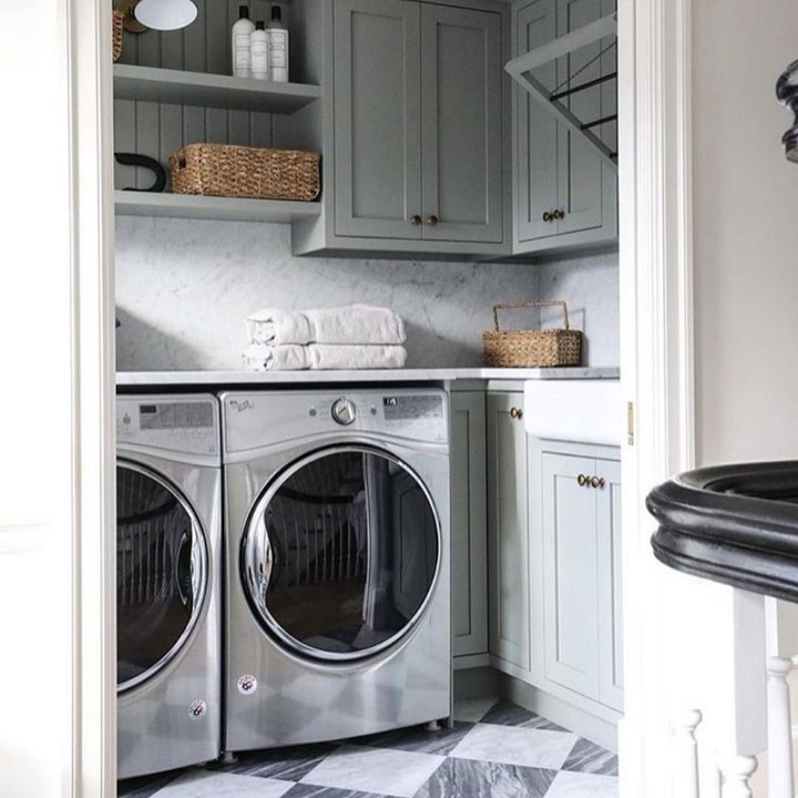 Compact sage laundry room with patterned floor