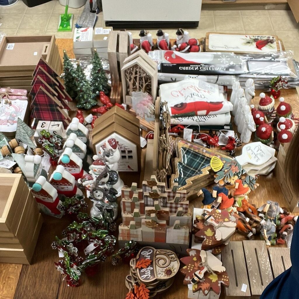 Assorted holiday and seasonal decorations spread on floor