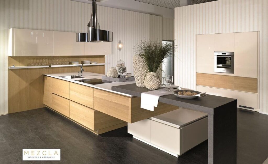 Luxurious beige kitchen with wood island cream cabinets and modern appliances.