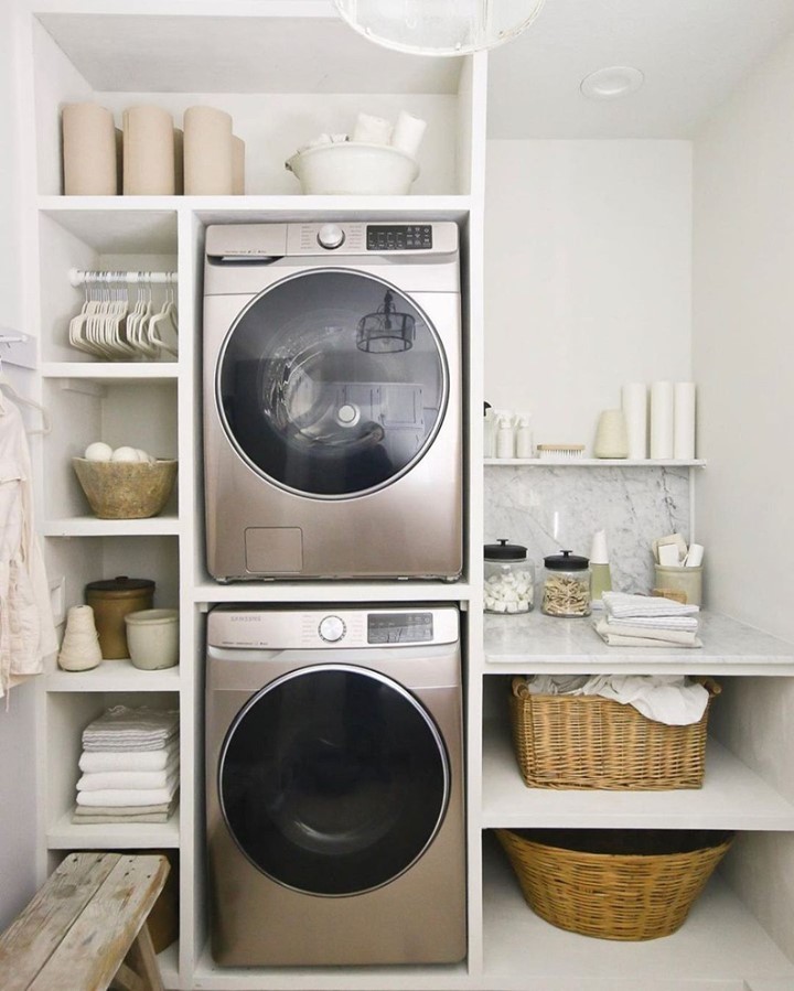 Minimalist laundry nook with built-in shelving