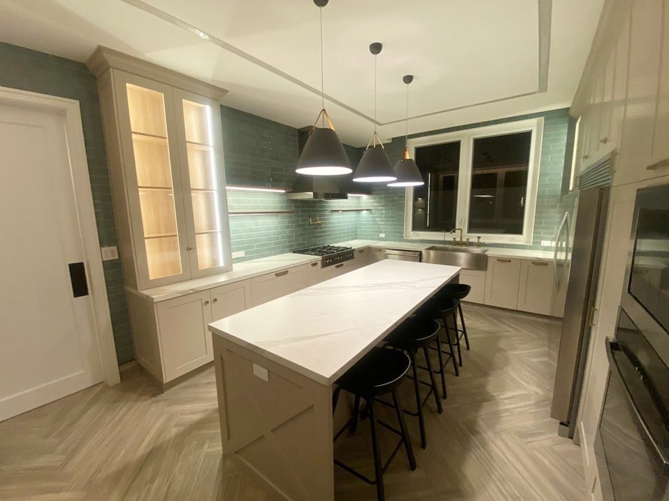 Modern white kitchen with teal backsplash