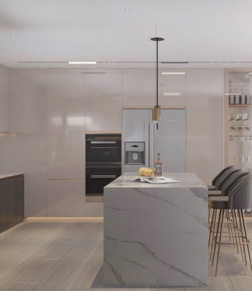 Modern white kitchen featuring marble island and sleek cabinetry