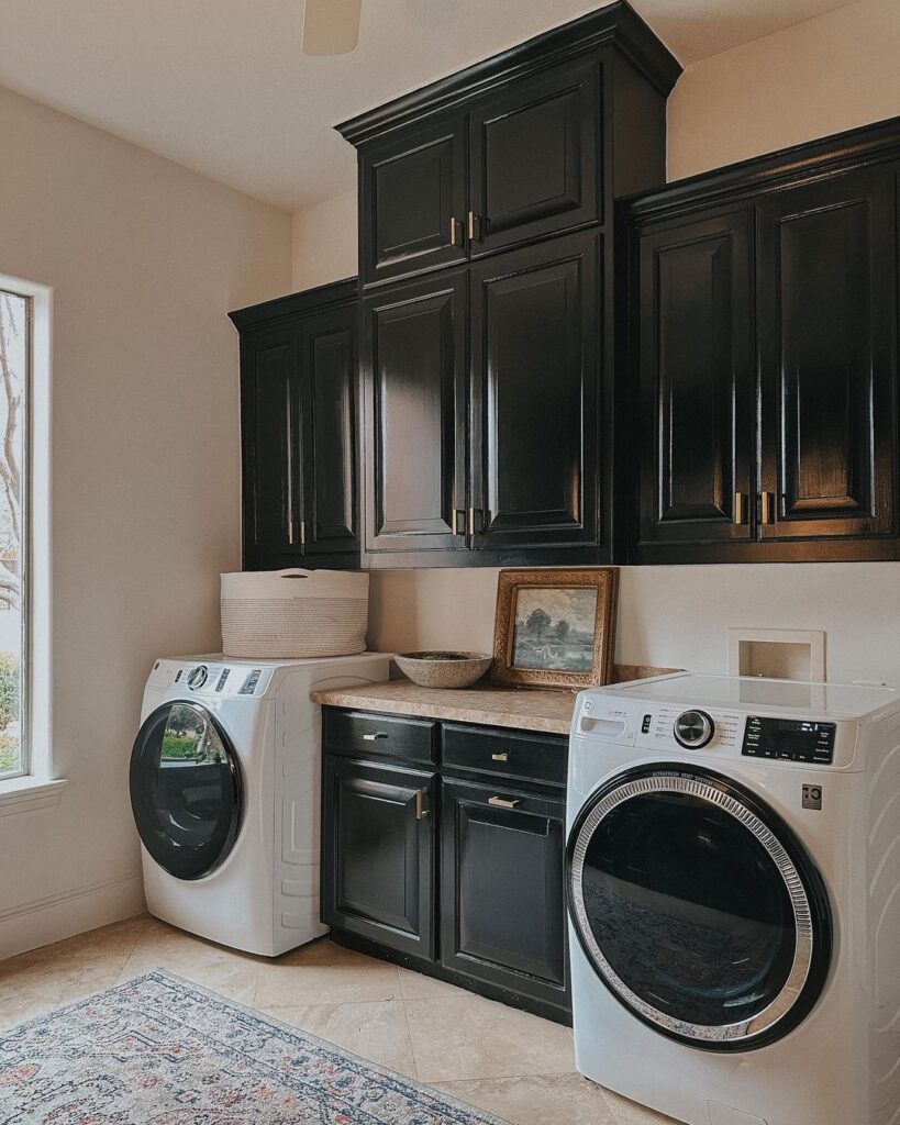 Laundry room with black cabinets and white appliances