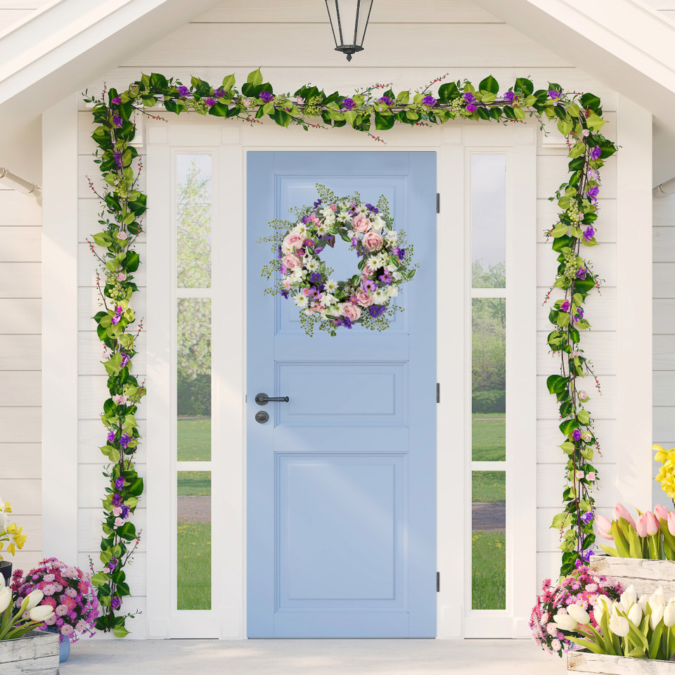 Blue door with floral wreath and flower garland