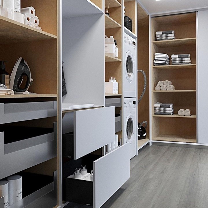 Modern laundry room with built-in storage and hidden appliances