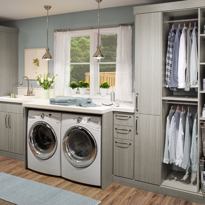 Bright laundry room with window and adjoining closet.