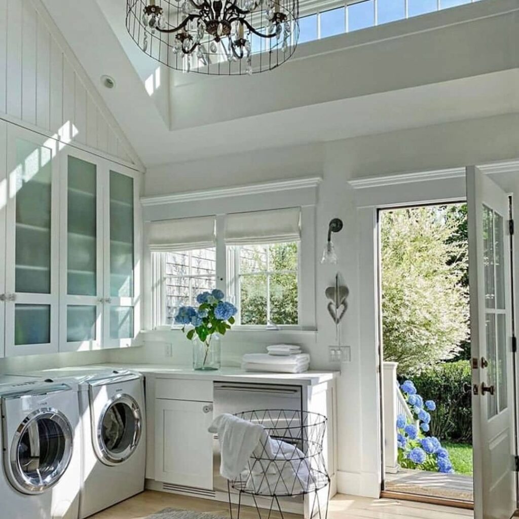 Bright, luxurious laundry room with garden view.