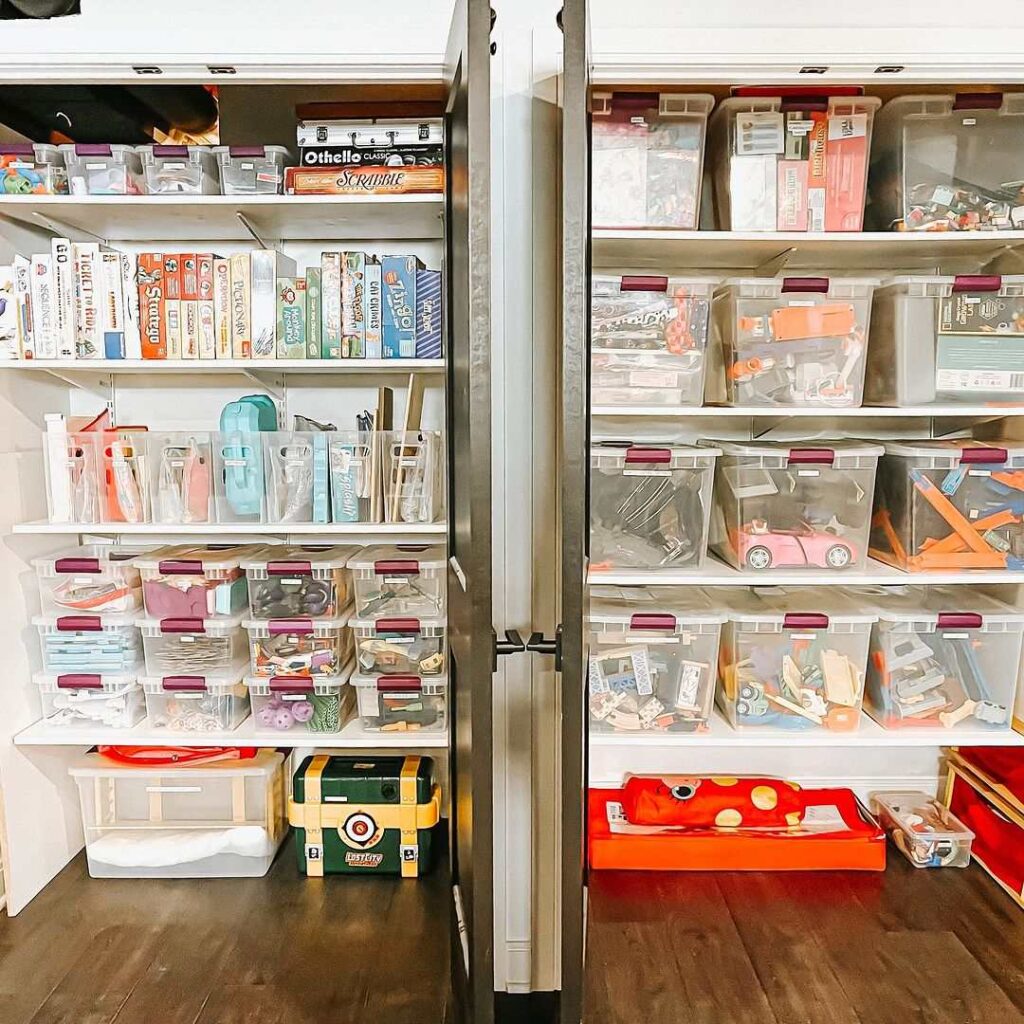 Organized shelves with games and toy containers