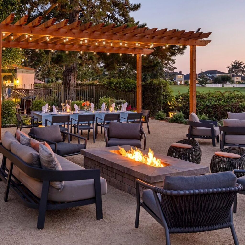 Backyard pergola fire pit lounge area sunset