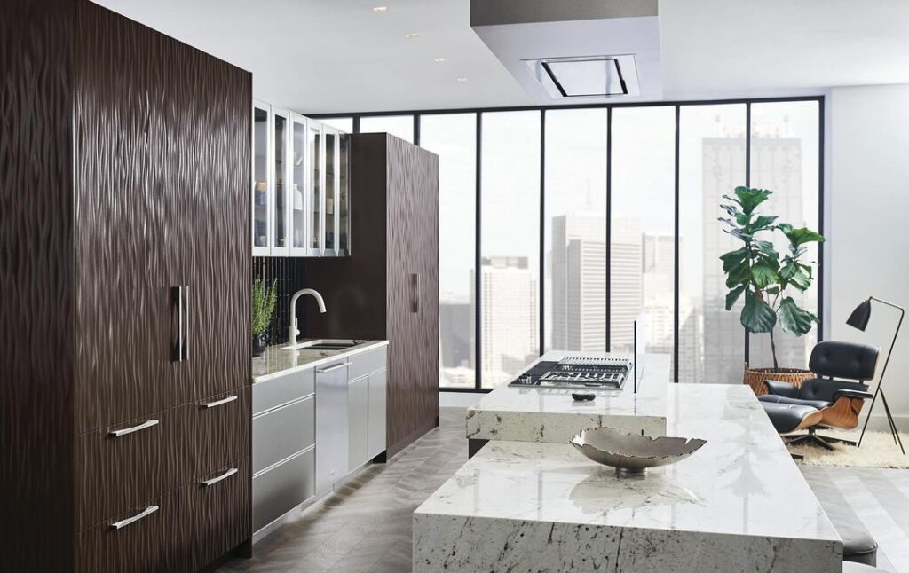 Sleek urban kitchen with dark wood cabinets and city view.