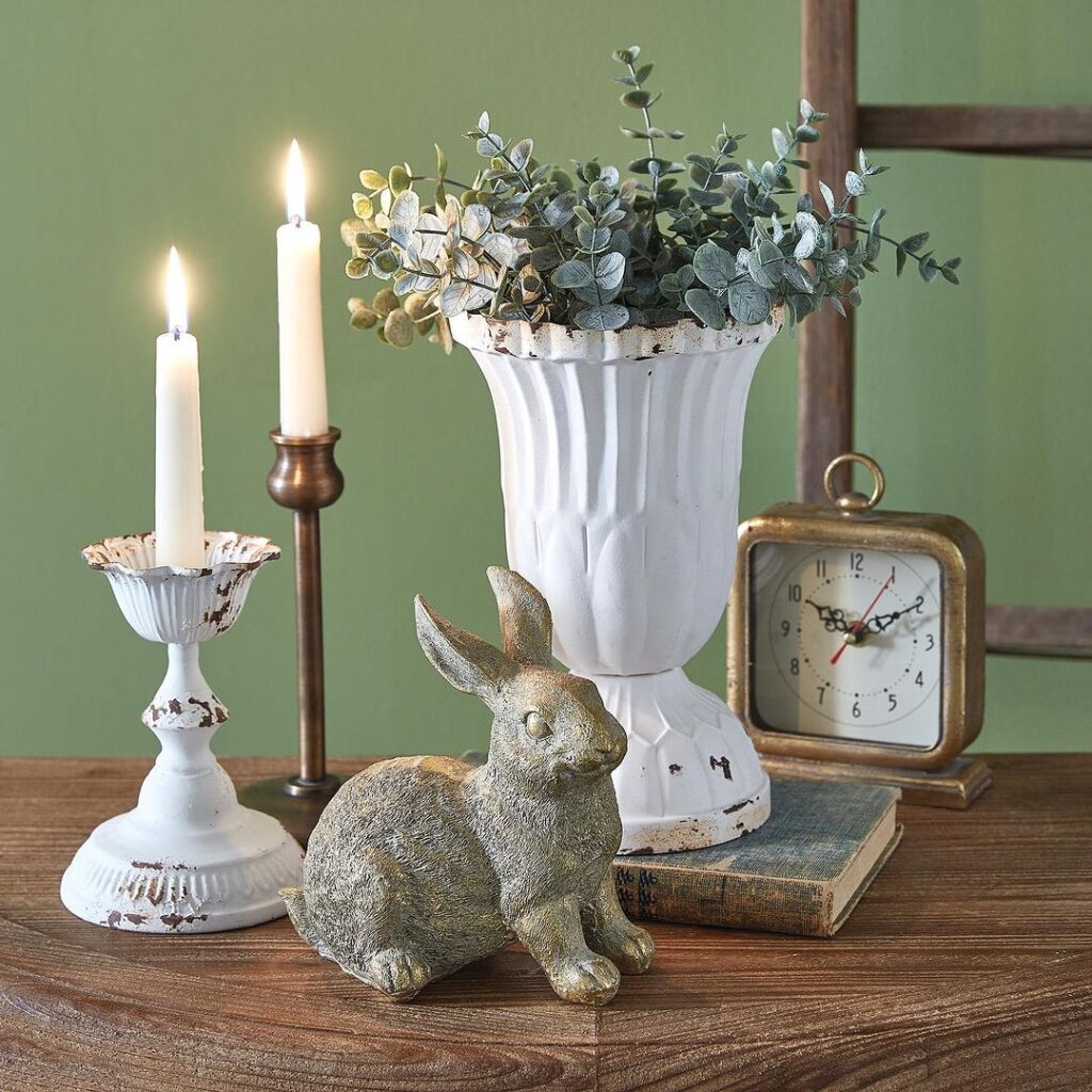 Vintage style decor with urn plant candles rabbit figurine clock