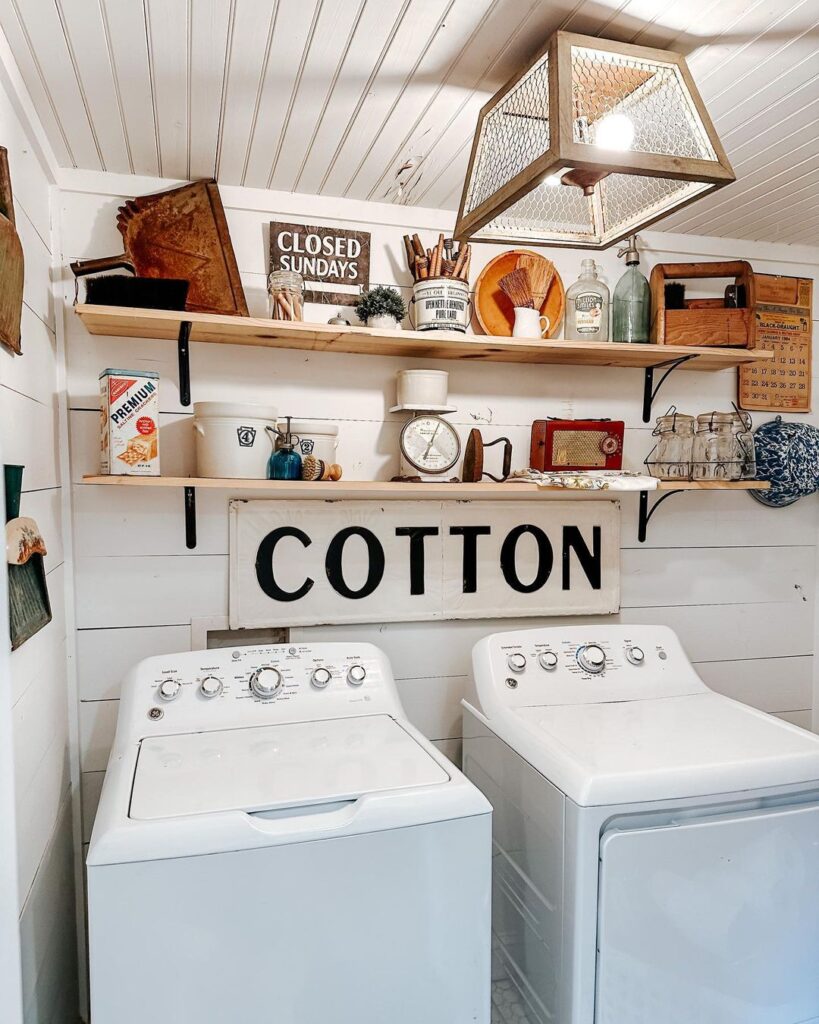 Laundry room with vintage decorations wooden shelves and white appliances