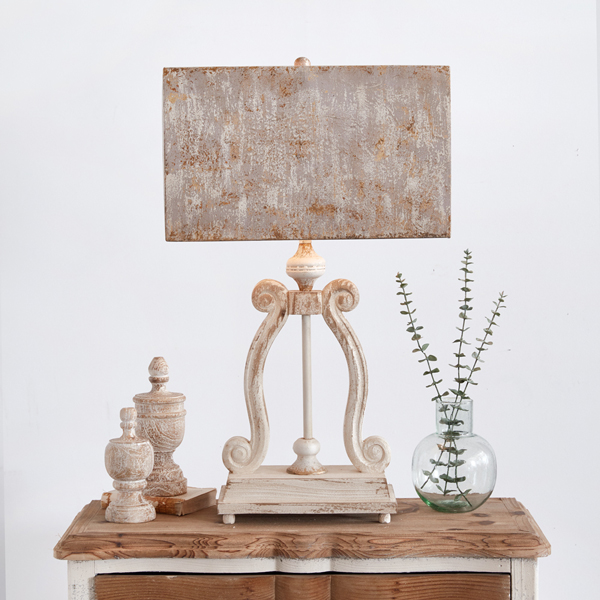 Rustic lamp with wooden ornaments and plant vase.