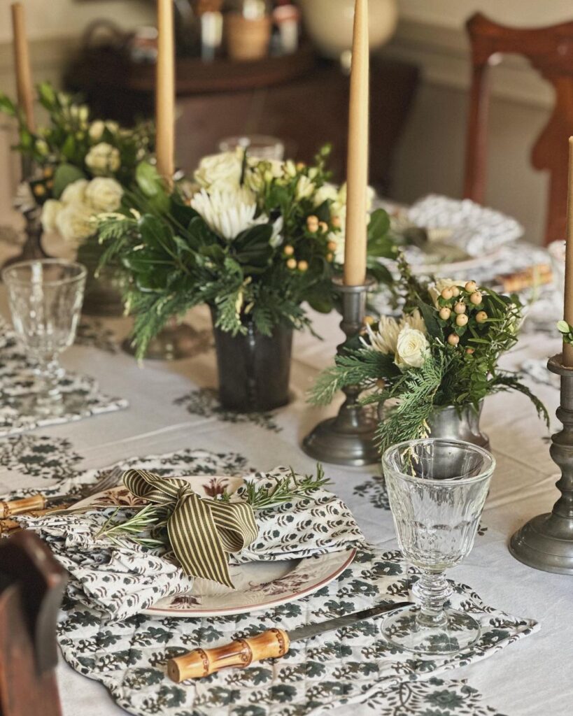 Elegant Thanksgiving table with white floral arrangements and candles