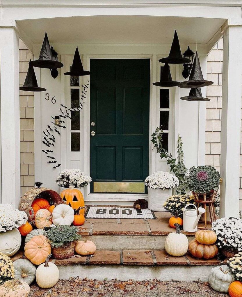 Porch decorated with floating witch hats and fall decor