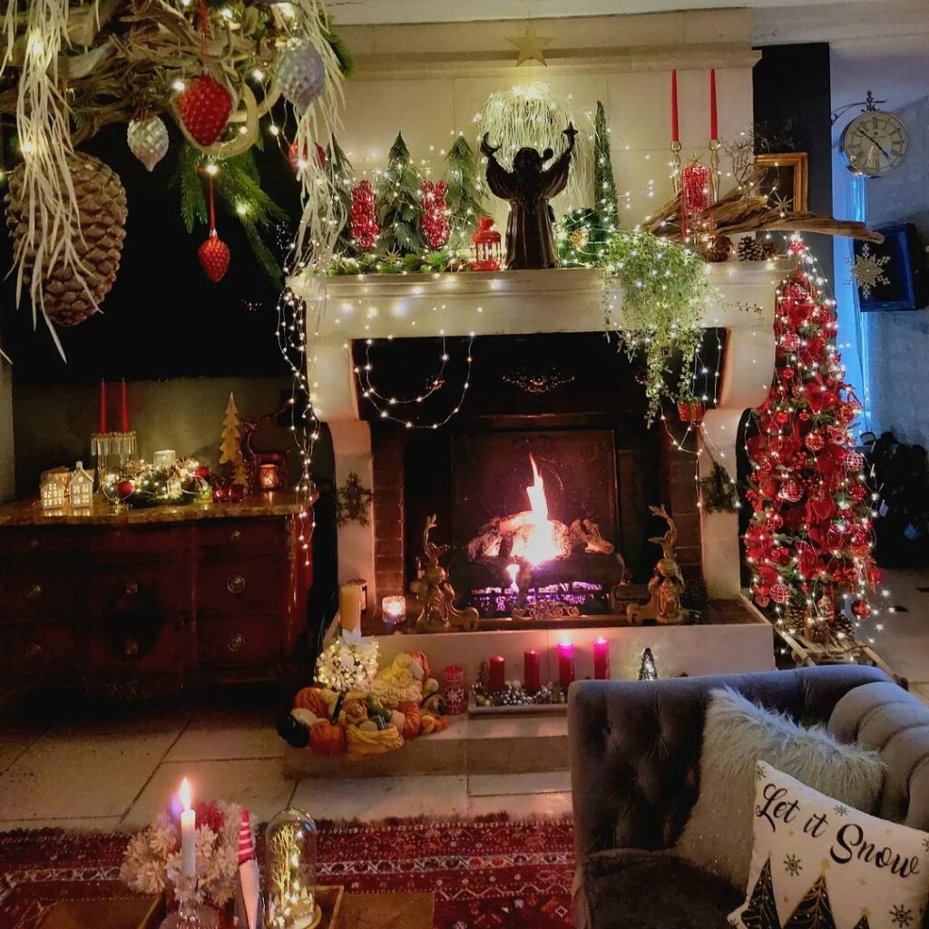 Festive fireplace with angel decorations and glowing Christmas accents