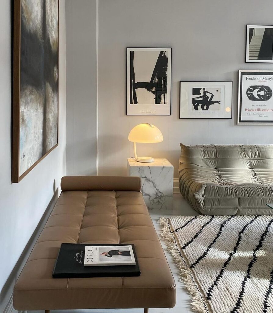 Stylish living room corner with daybed and modern art.