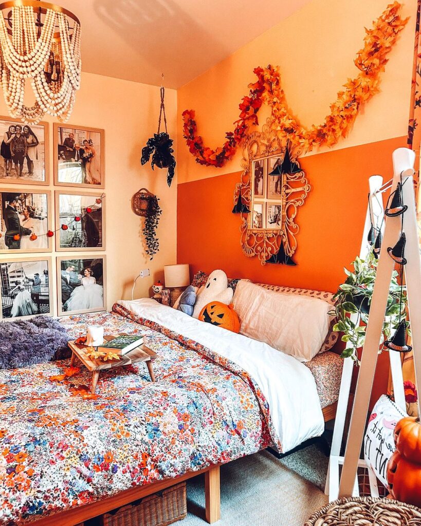 Boho bedroom with orange walls and Halloween accents