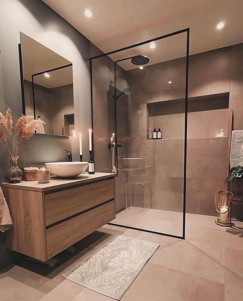 Elegant bathroom with wood vanity and glass shower.