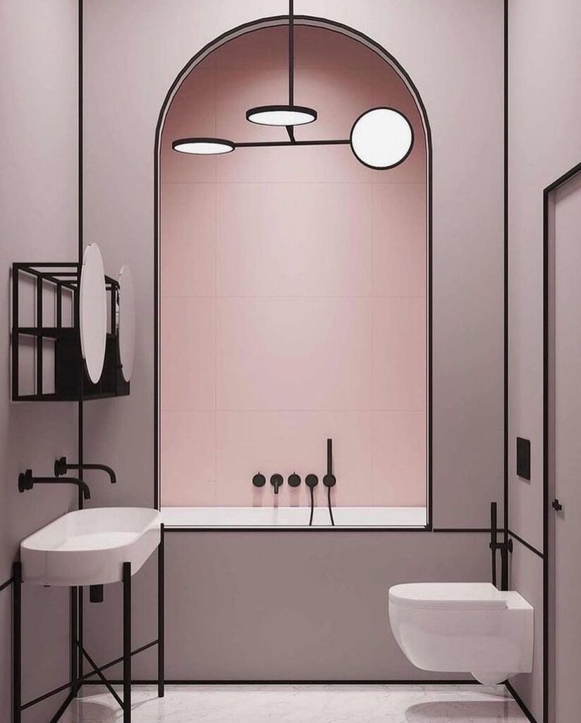 Modern bathroom with pink arch, black fixtures, and minimalist design.