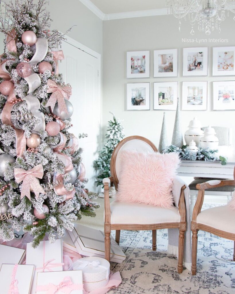 Pink and silver decorated Christmas tree with elegant pastel decor.