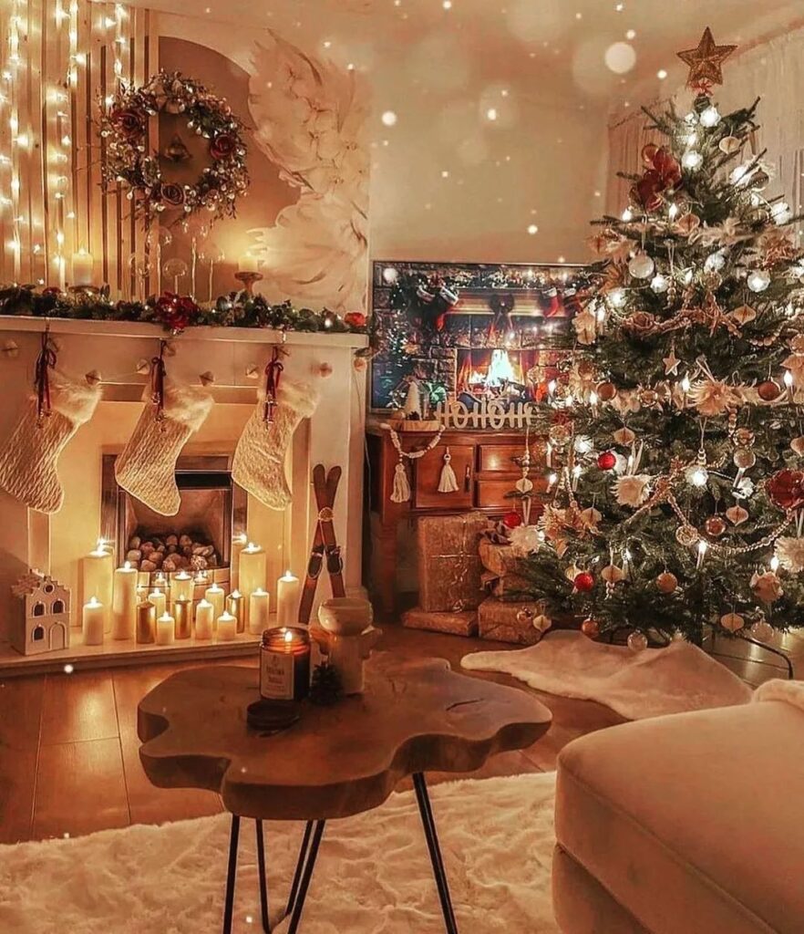 Cozy Christmas living room with candle filled fireplace and glowing tree