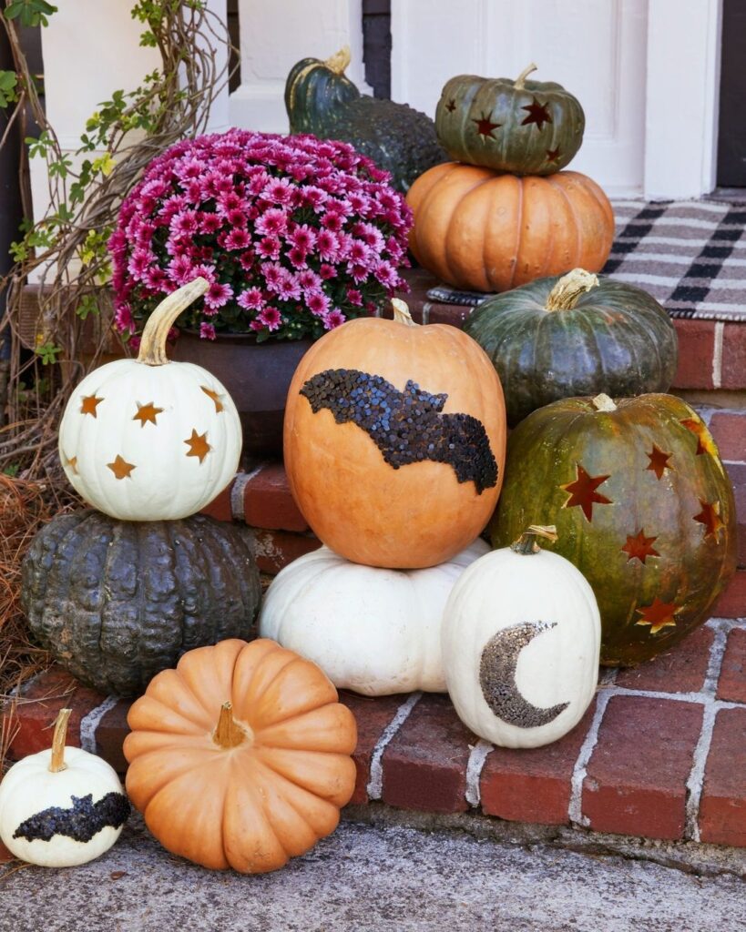 Decorated pumpkins with star moon and bat designs