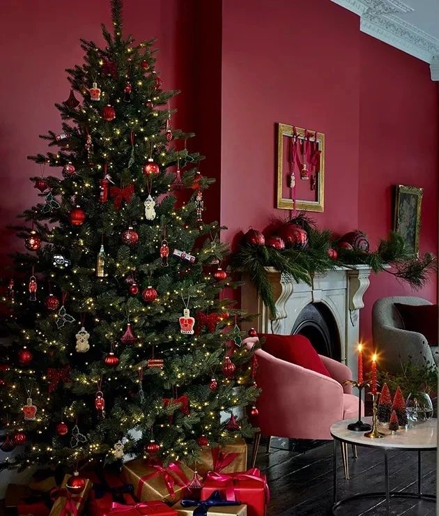 "Vintage crimson room with decorated evergreen tree fireplace"