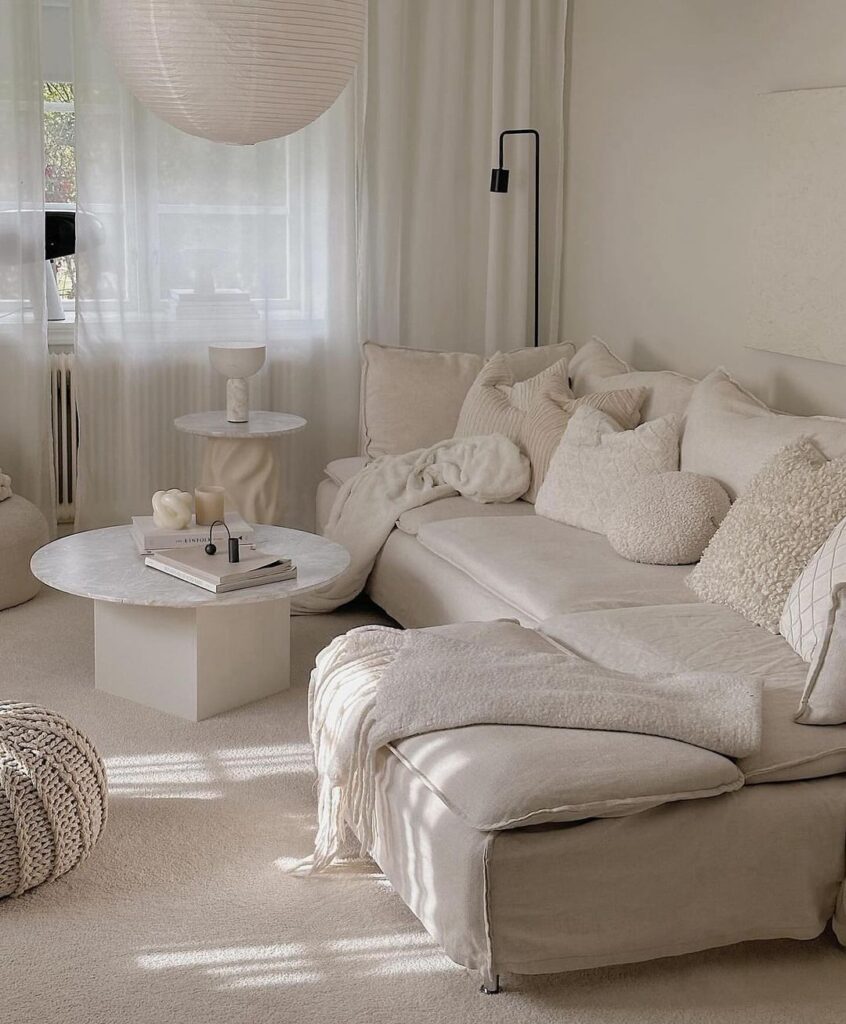 All-white living room with cozy sofa and soft textures